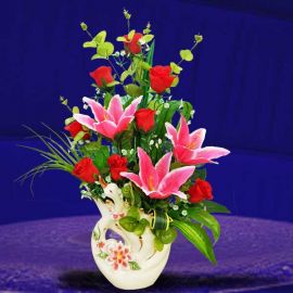 Artificial Lilies in Elegant Swan Shaped Porcelain Vases