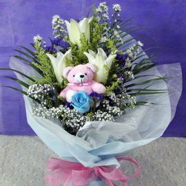 3 White Lily & 1 Blue Rose With Bear at centercenter
