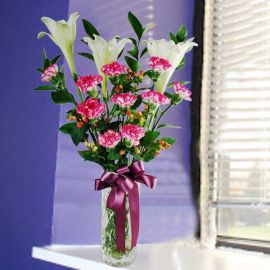 3 White Lilies & 10 Pink Carnations in Glass Vase.