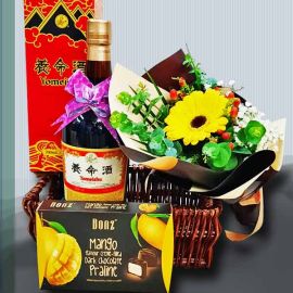 Gerbera with Yomeishu Health Tonic (700ml) and Chocolates in a Basket.